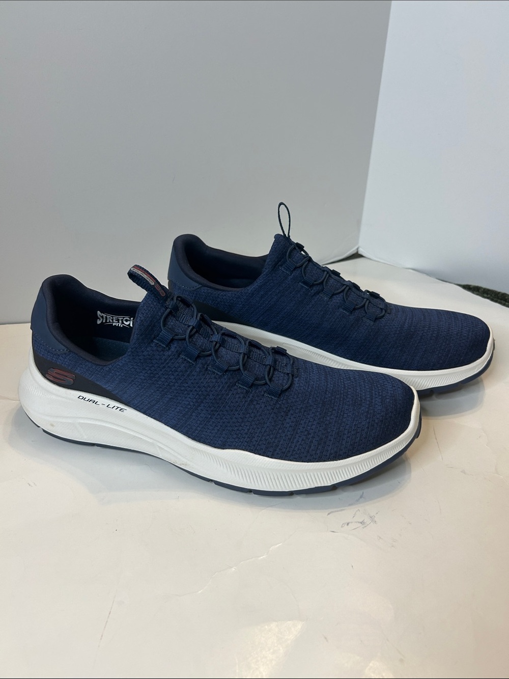 Men’s Skechers Navy Slip-On Sneakers - Lightweight, air cooled memory foam.